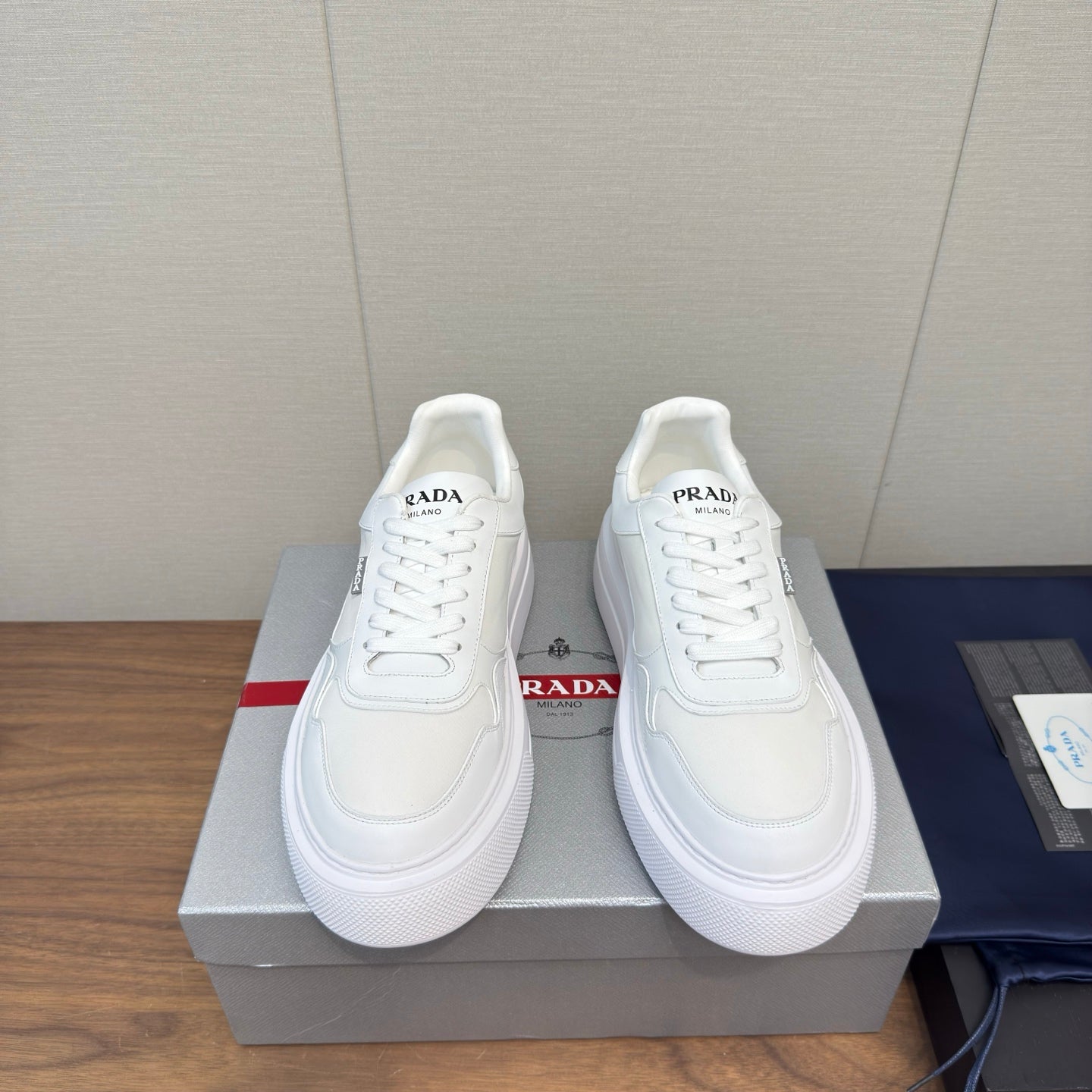 PRADA 25S DOWNTOWN BOLD SNEAKERS 45MM IN WHITE CALFSKIN