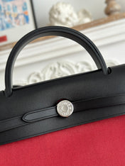 ZIP CABINE 31 BAG IN RUBY RED CANVAS AND BLACK CALFSKIN