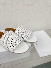 ALAIA VIENNE FLAT MULES IN WHITE LAMBSKIN
