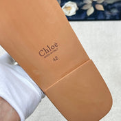 CHLOE 26S CRISSCROSS SLIDES IN BEIGE CANVAS