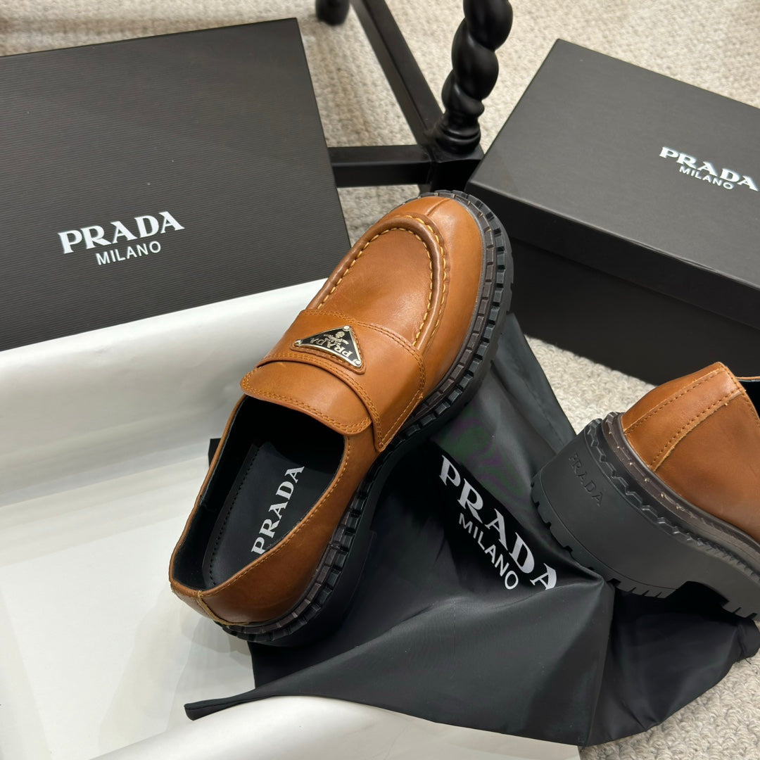 PRADA 25S LOAFER 50MM IN BURNT ORANGE CALFSKIN LOGO