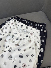 ALL-OVER LOGO PRINTED PANTS WITH STRETCH WAIST