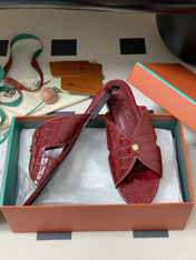 FLAT SLIPPERS IN RED CALFSKIN SNAKE EMBOSSING