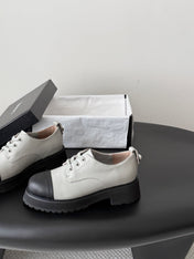 CHANEL 26S LACE UP PLATFORM IN BLACK AND GREY CALFSKIN
