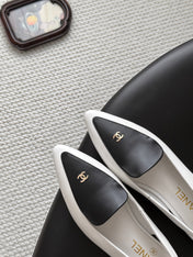 CHANEL 26S SLINGBACK FLAT IN BLACK AND WHITE CALFSKIN