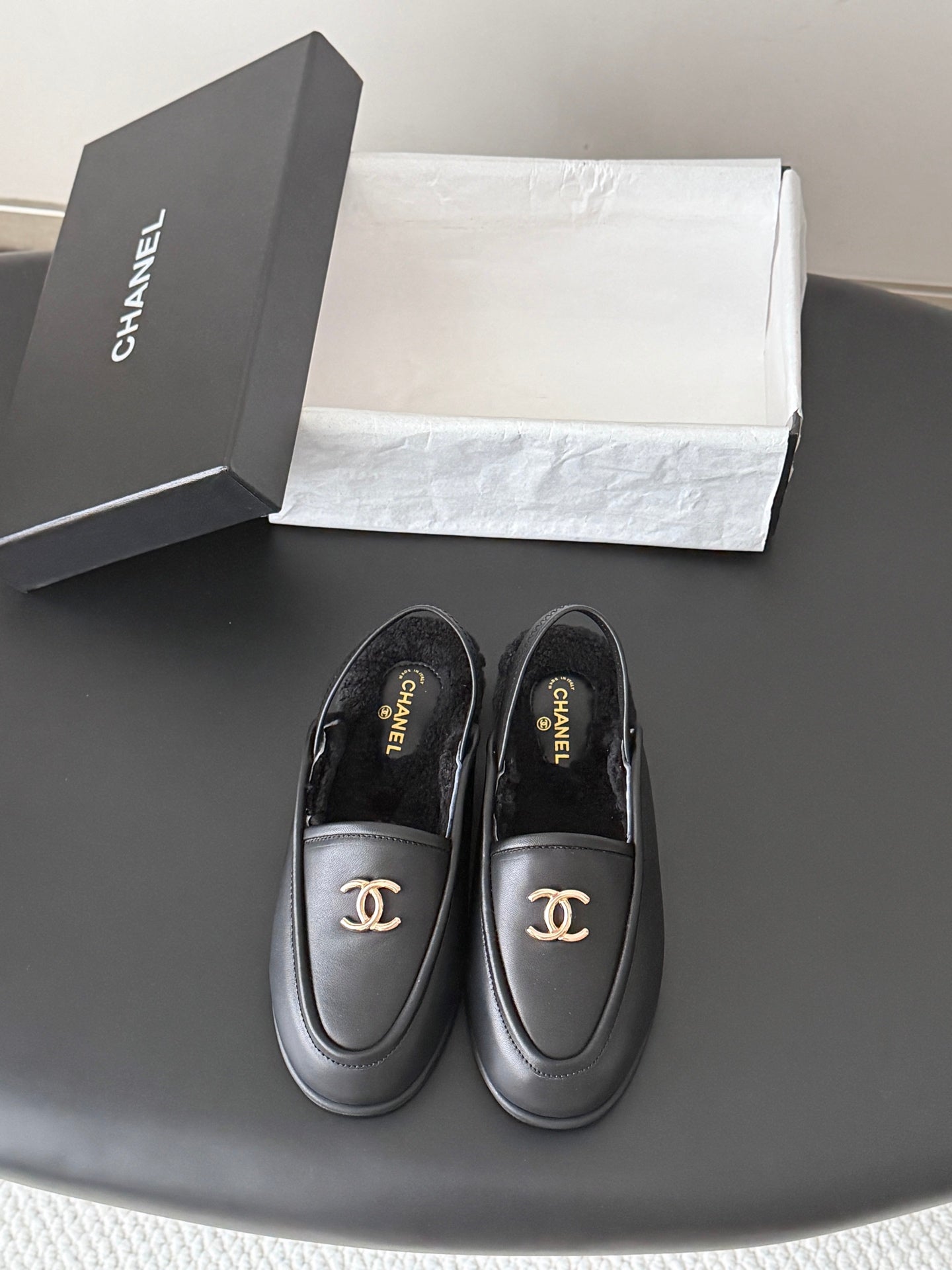 CHANEL 26S SLINGBACK LOAFERS IN BLACK CALFSKIN AND SHEARLING LINING