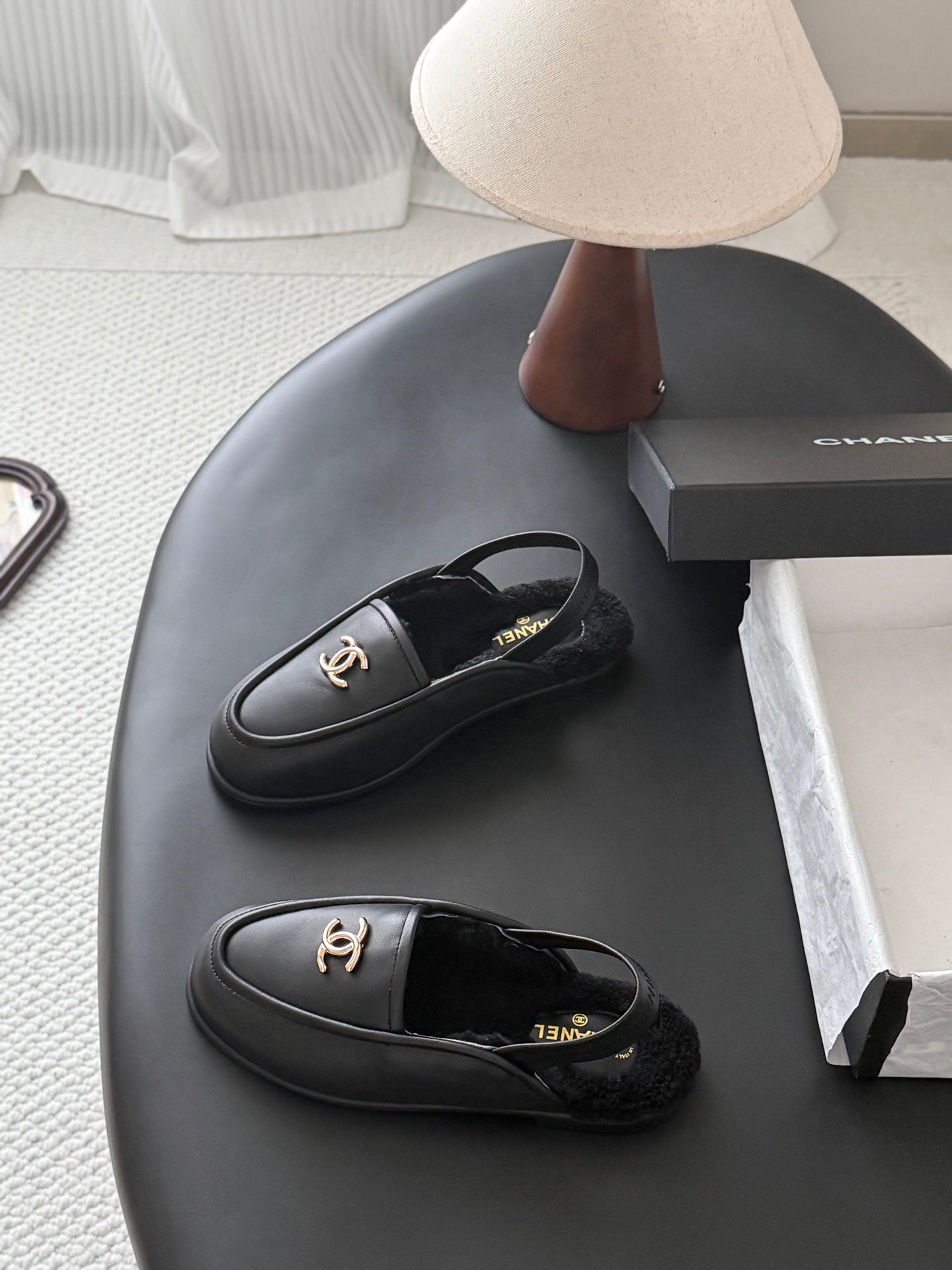 CHANEL 26S SLINGBACK LOAFERS IN BLACK CALFSKIN AND SHEARLING LINING