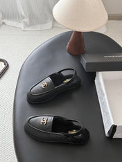 CHANEL 26S SLINGBACK LOAFERS IN BLACK CALFSKIN AND SHEARLING LINING