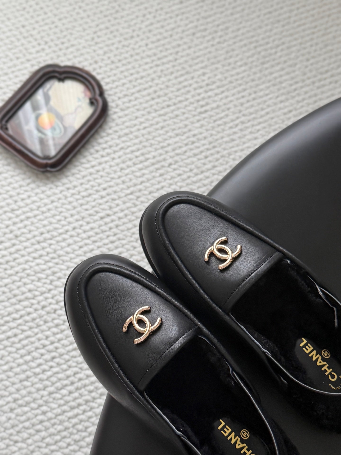 CHANEL 26S SLINGBACK LOAFERS IN BLACK CALFSKIN AND SHEARLING LINING