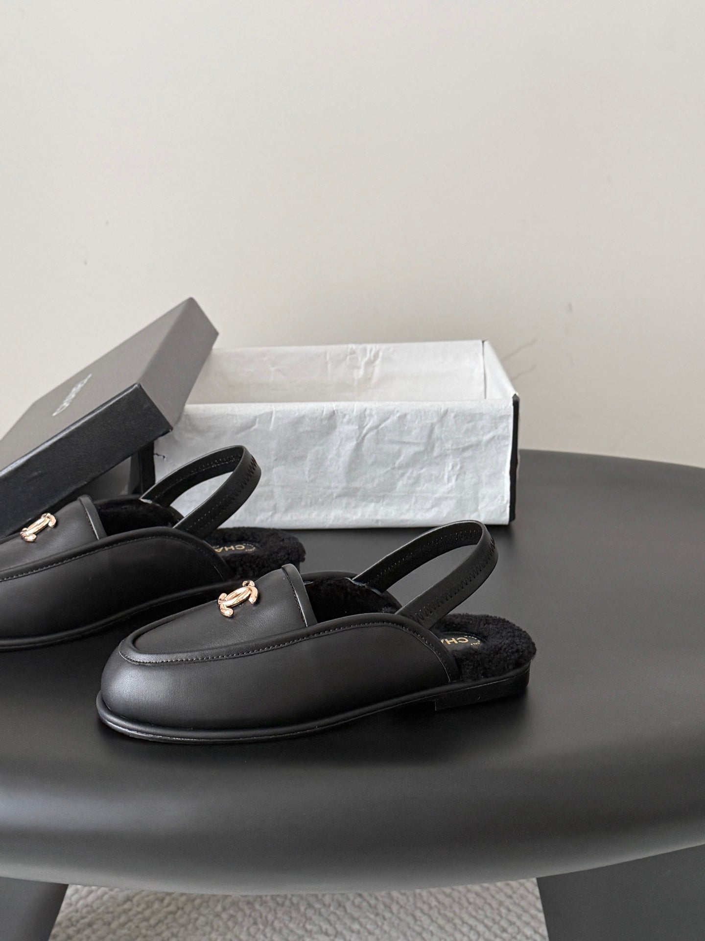CHANEL 26S SLINGBACK LOAFERS IN BLACK CALFSKIN AND SHEARLING LINING