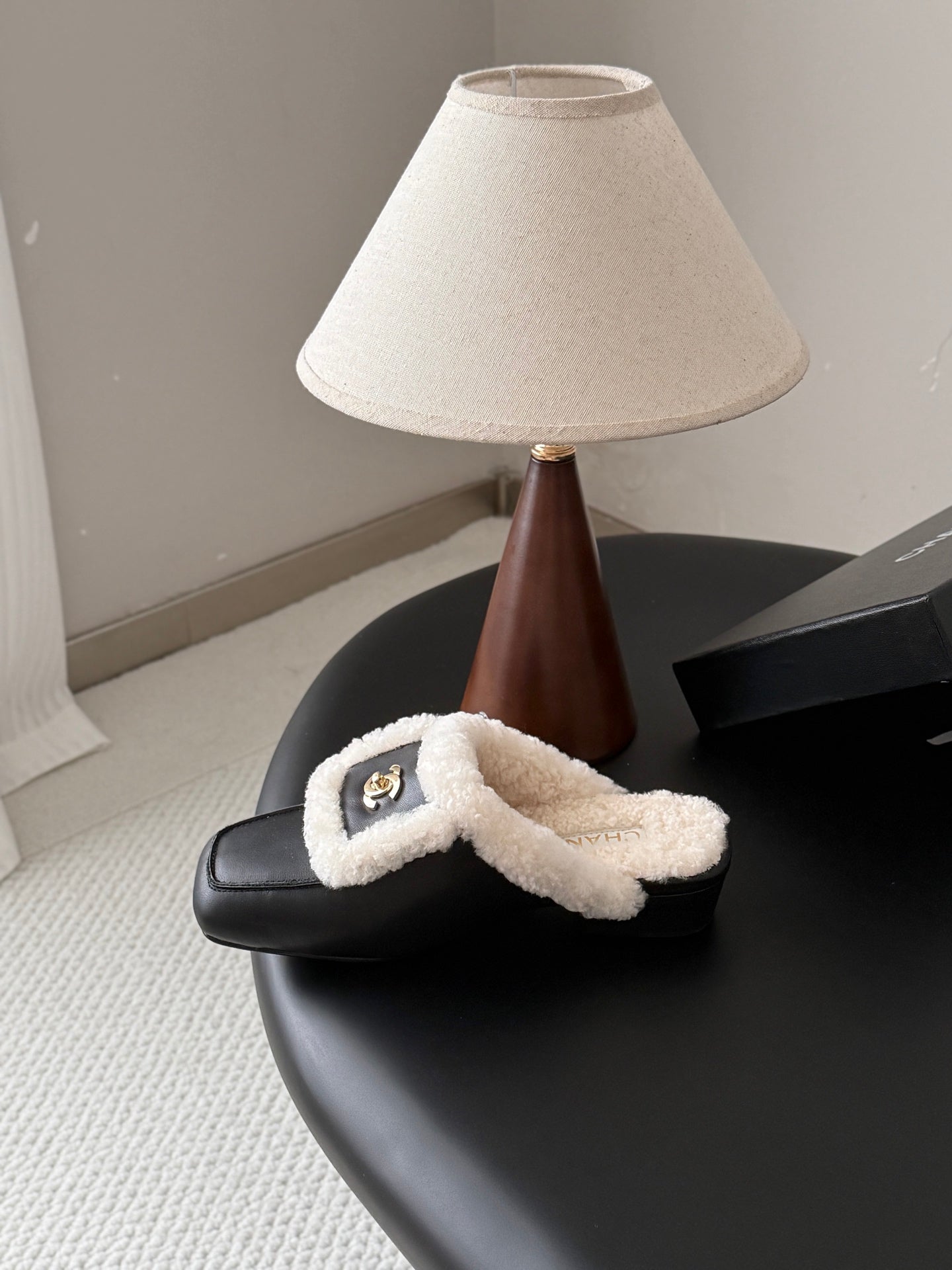 CHANEL 26S MULES IN BLACK SHEARLING AND CALFSKIN