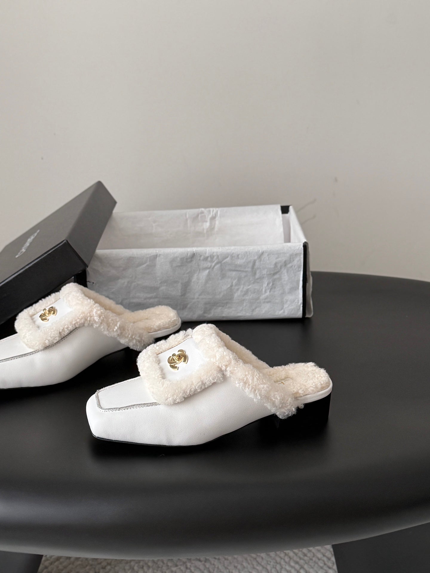 CHANEL 26S MULES IN WHITE SHEARLING AND CALFSKIN