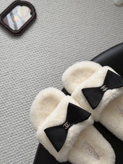 CHANEL 26S SLIDE SANDALS IN WHITE SHEARLING WITH BLACK BOW