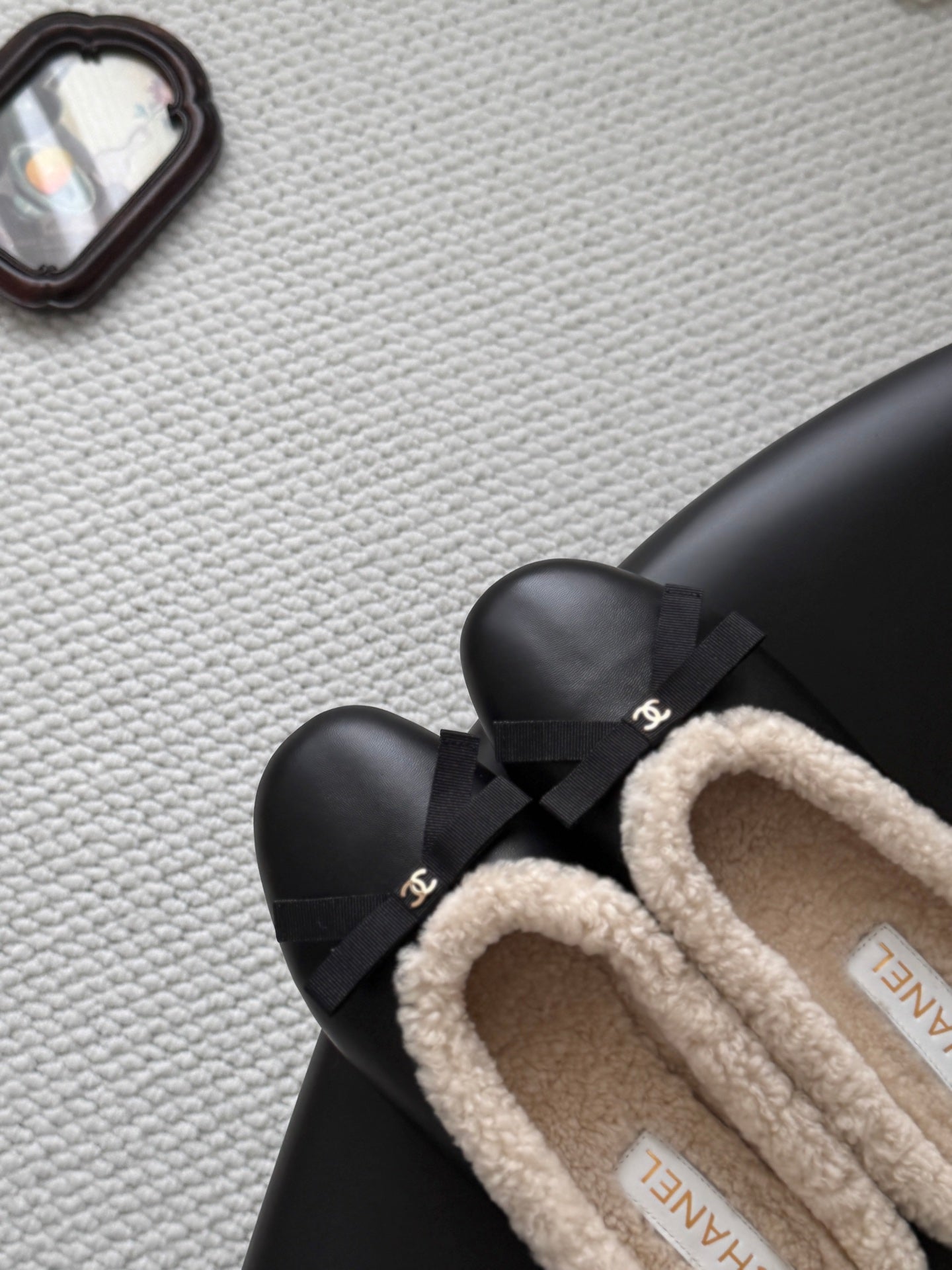 CHANEL 26S MULES IN BLACK LAMBSKIN AND SHEARLING