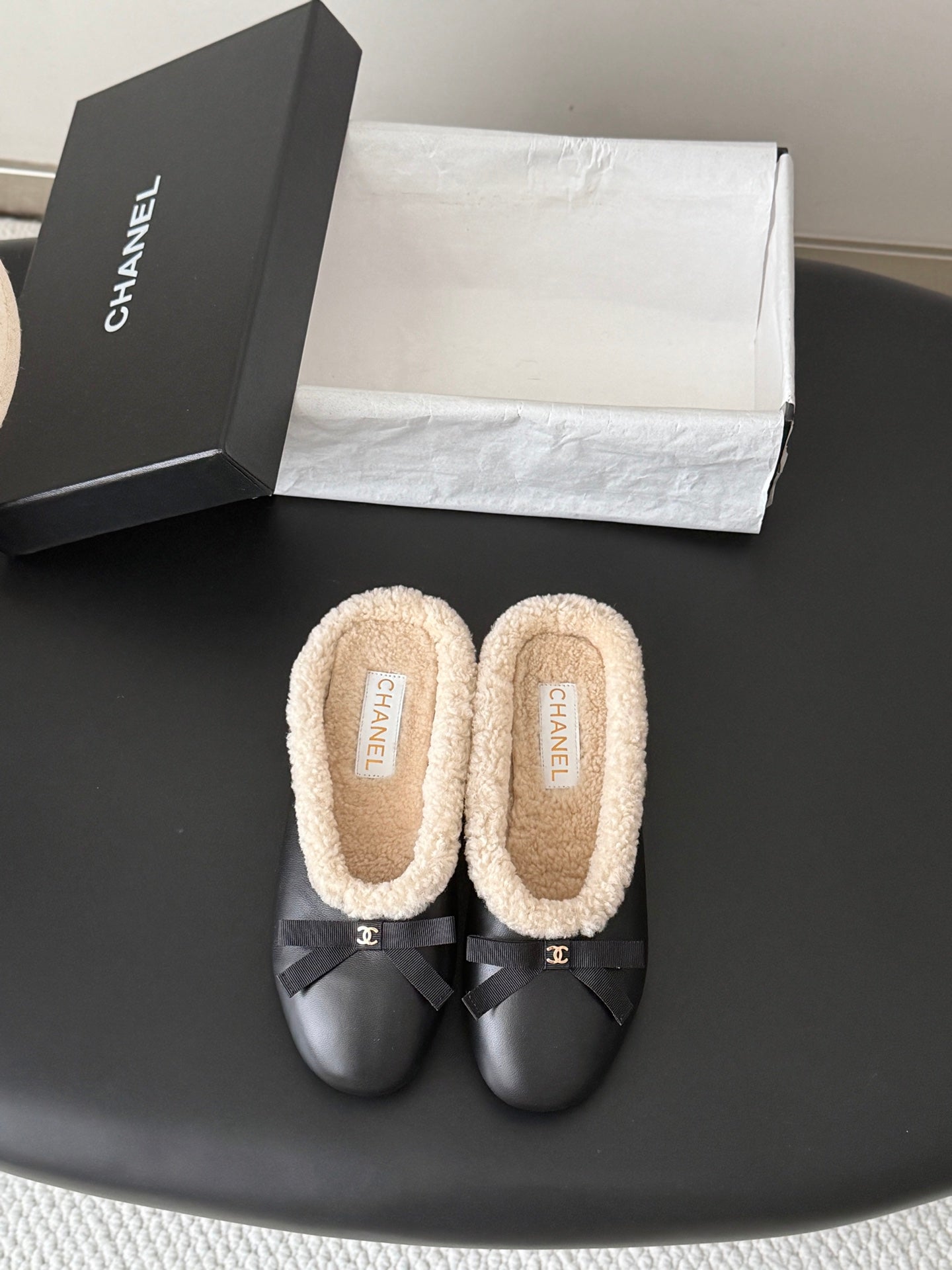 CHANEL 26S MULES IN BLACK LAMBSKIN AND SHEARLING