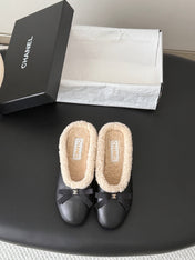CHANEL 26S MULES IN BLACK LAMBSKIN AND SHEARLING