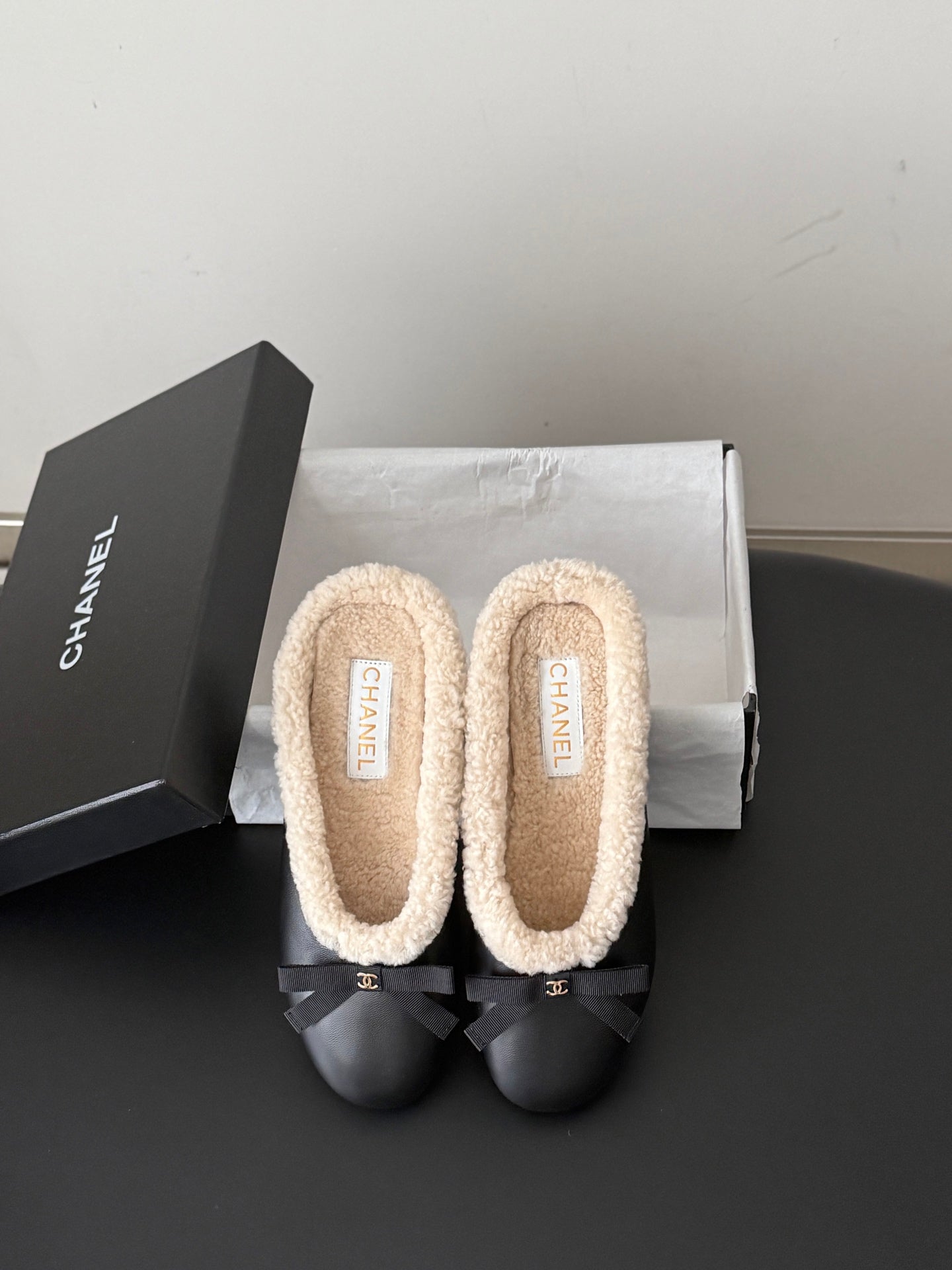 CHANEL 26S MULES IN BLACK LAMBSKIN AND SHEARLING