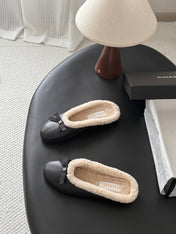 CHANEL 26S MULES IN BLACK LAMBSKIN AND SHEARLING
