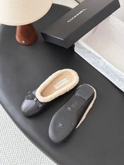 CHANEL 26S MULES IN BLACK LAMBSKIN AND SHEARLING