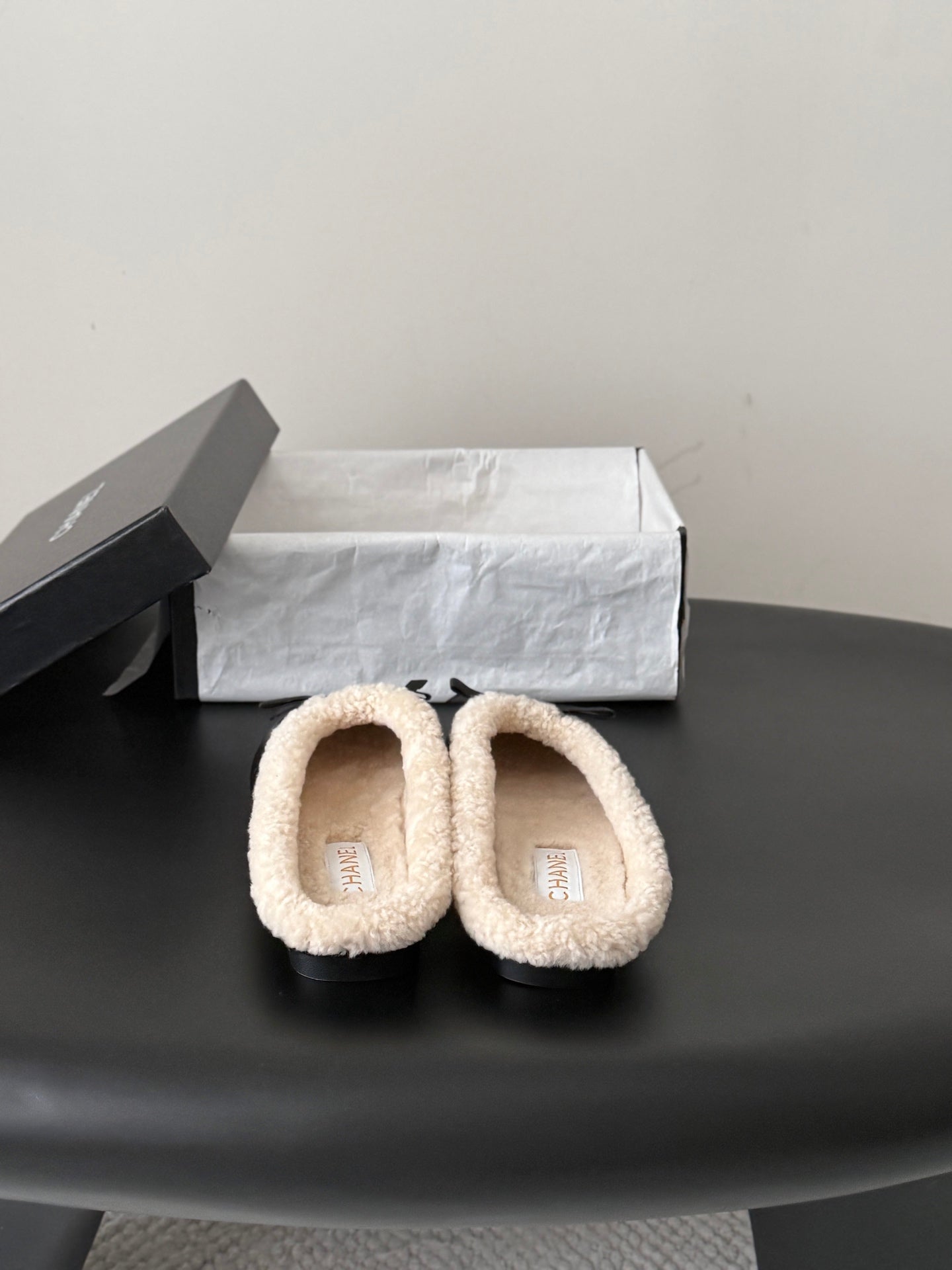 CHANEL 26S MULES IN BLACK LAMBSKIN AND SHEARLING