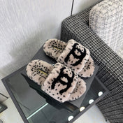 CHANEL 26S PLATFORM SLIDE SANDALS IN GRAY AND BLACK SHEARLING DALMATIAN PRINT