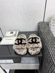CHANEL 26S PLATFORM SLIDE SANDALS IN GRAY AND BLACK SHEARLING DALMATIAN PRINT