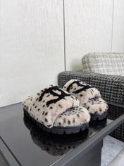 CHANEL 26S PLATFORM SLIDE SANDALS IN GRAY AND BLACK SHEARLING DALMATIAN PRINT