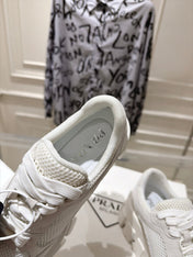 PRADA 26S GEAR SOLE SNEAKERS IN WHITE SUEDE AND MESH