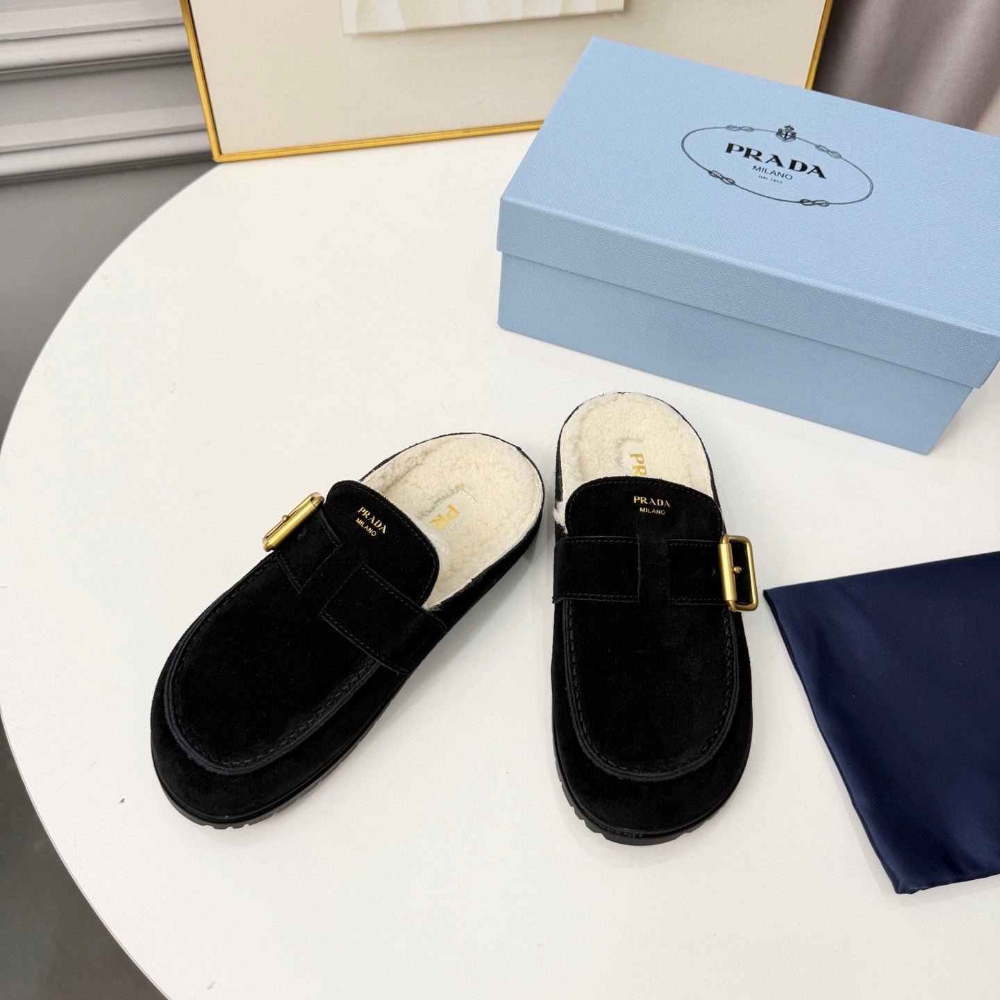 PRADA 26S SHEARLING-LINED MULES IN BLACK SUEDE