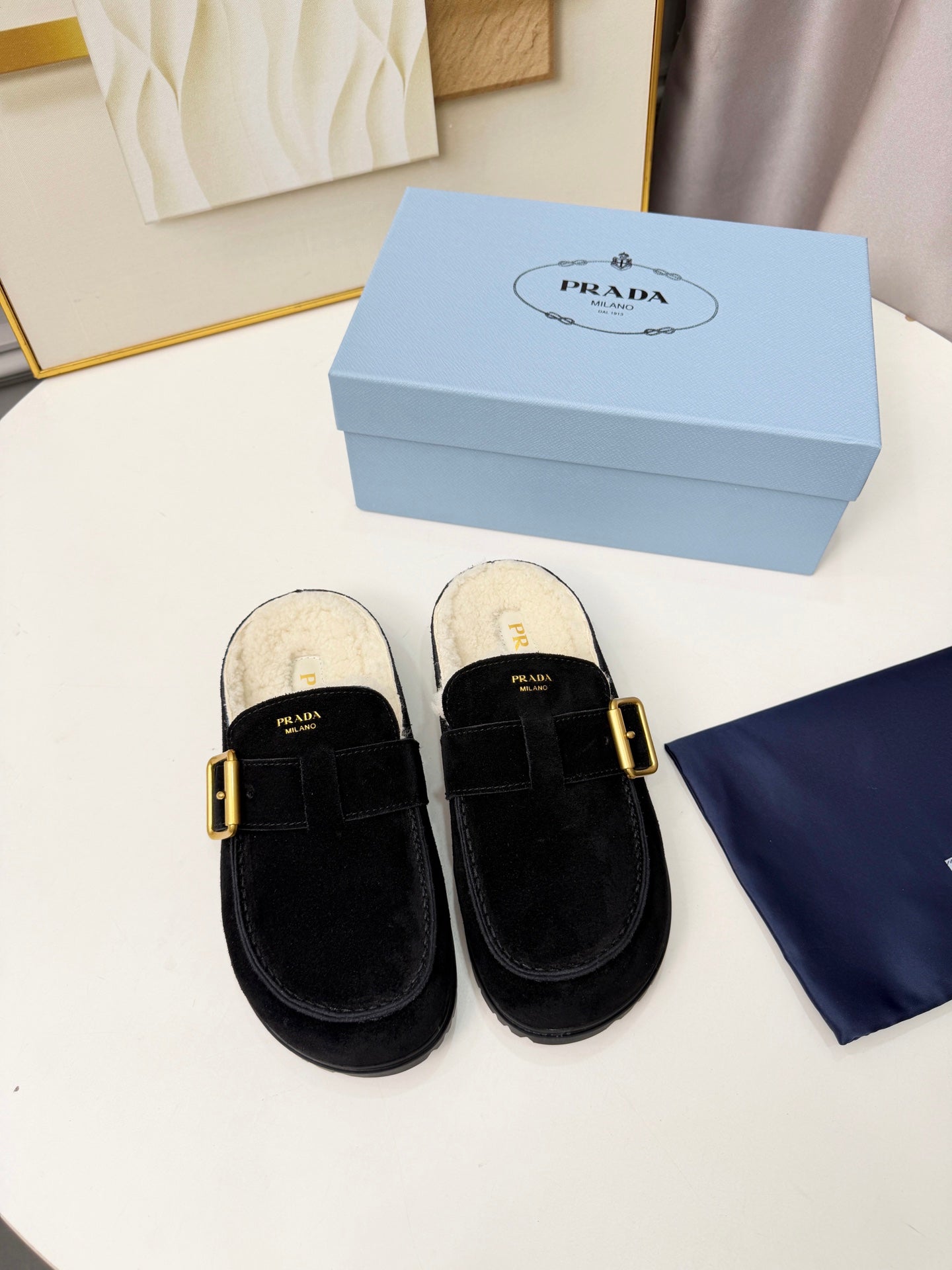 PRADA 26S SHEARLING-LINED MULES IN BLACK SUEDE