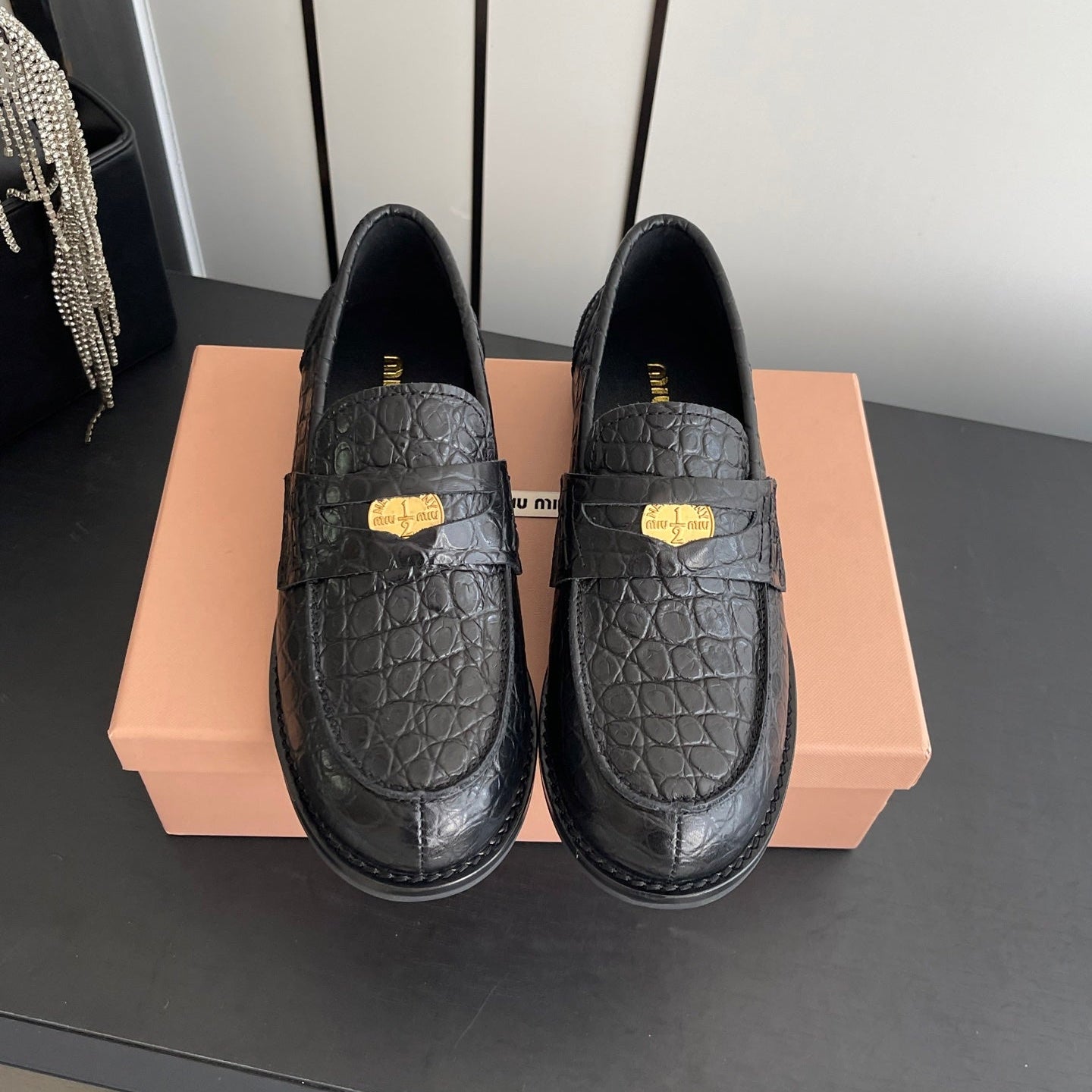 MIUMIU 26S PENNY LOAFERS IN BLACK CALFSKIN CROCODILE EMBOSSING