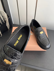 MIUMIU 26S PENNY LOAFERS IN BLACK CALFSKIN CROCODILE EMBOSSING