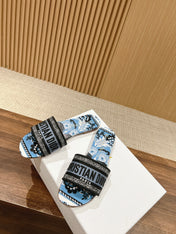DIOR 26S SLIDE SANDALS IN BLUE FLORAL PRINT LOGO STRAP