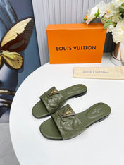 LV 26S MARE FLAT MULES IN MOSS GREEN CALFSKIN