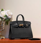 KELLY SELLIER 25 BAG IN BLACK OSTRICH LEATHER WITH GOLD HARDWARE