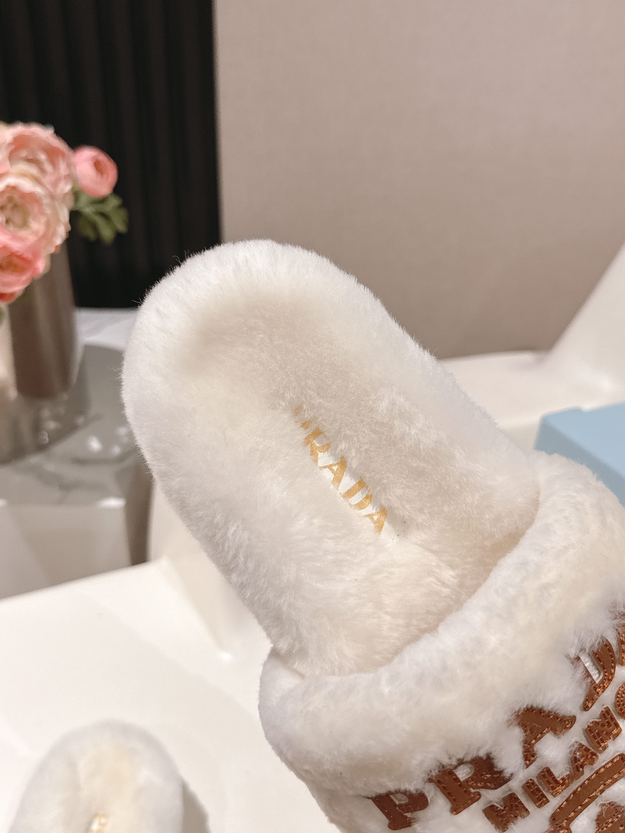 PRADA 25S FLAT MULES IN WHITE RABBIT FUR