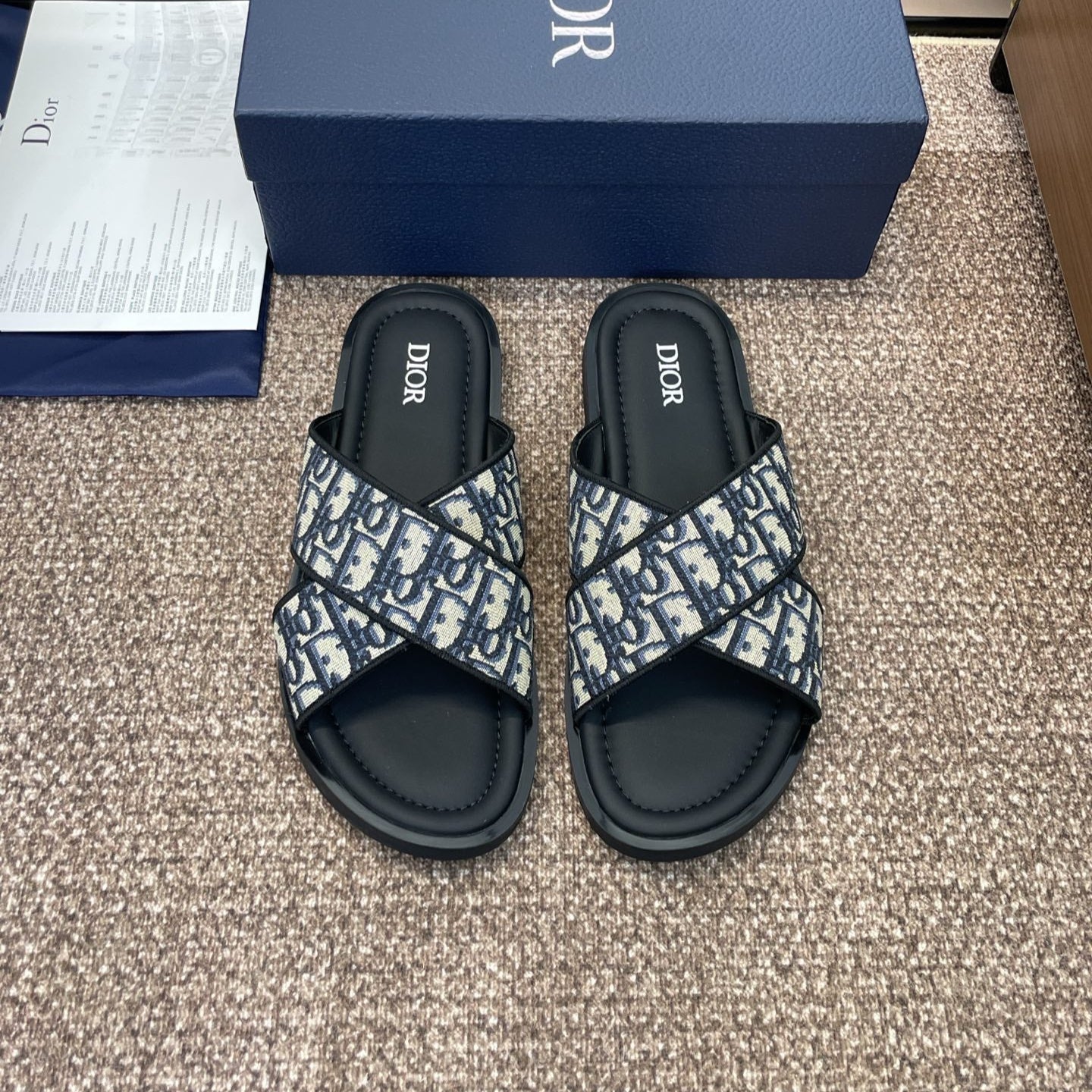 DIOR 25S ALIAS CROSS-STRAP SLIDES IN BLACK CALFSKIN WITH CD OBLIQUE DEEP BLUE LOGO