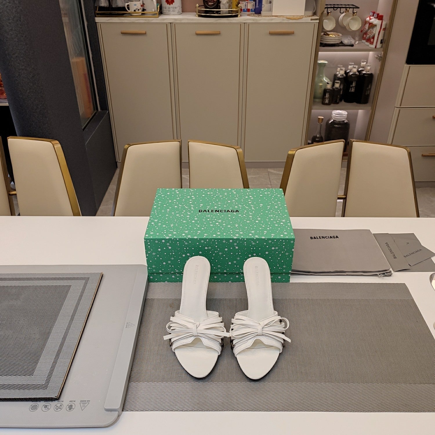 BOW-EMBELLISHED HIGH MULES IN WHITE SHEEPSKIN