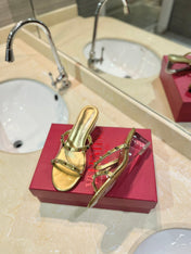 ROCKSTUD MULE SANDALS IN GOLD CALFSKIN AND TRANSPARENT PVC FILM